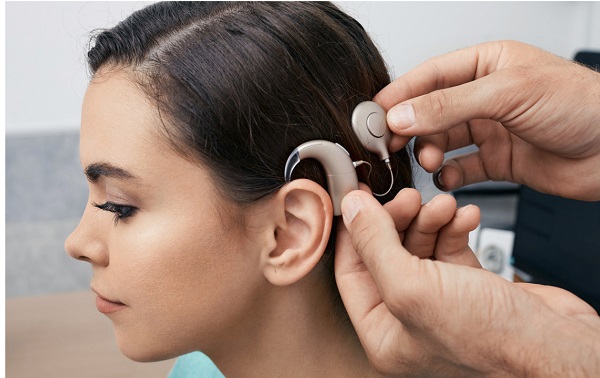 cochlear implant on-womans ear